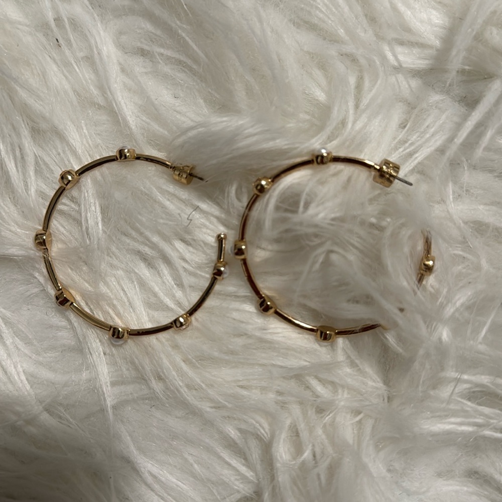 Coach earrings with clear stones and white pearly stones